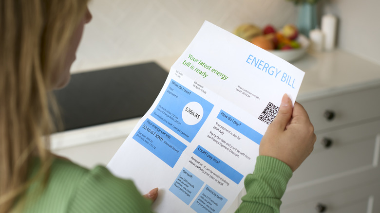 Woman holding energy bill
