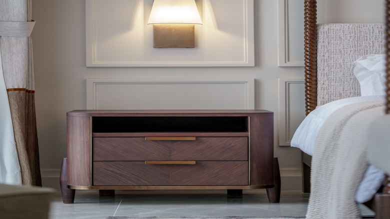 close-up of wall sconce above bedside table