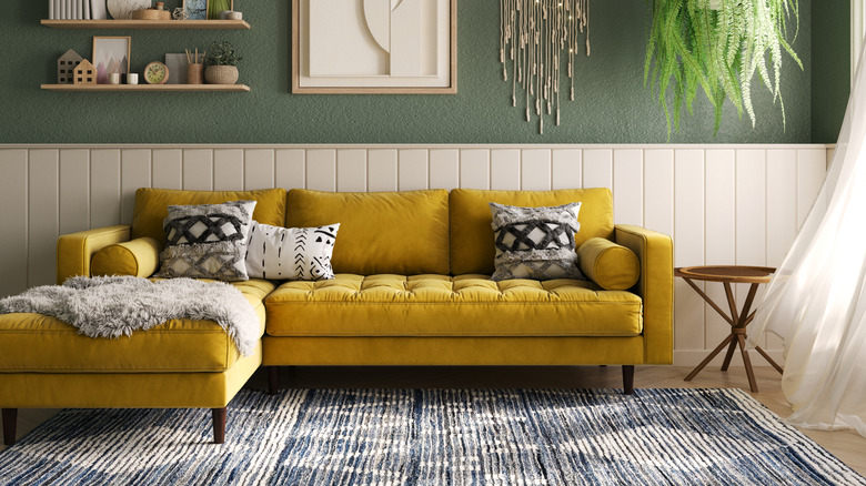 patterned living room rug with bold yellow couch