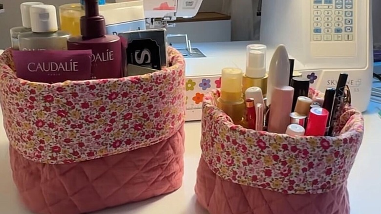 Fabric storage bins holding an assortment of toiletries