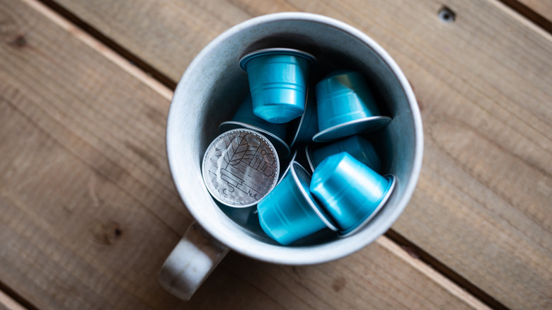A coffee mug holding coffee pods