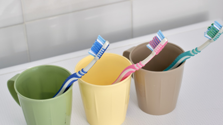 Toothbrushes in coffee mugs