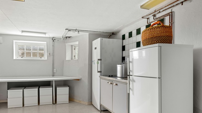 Storage basket on top of white fridge