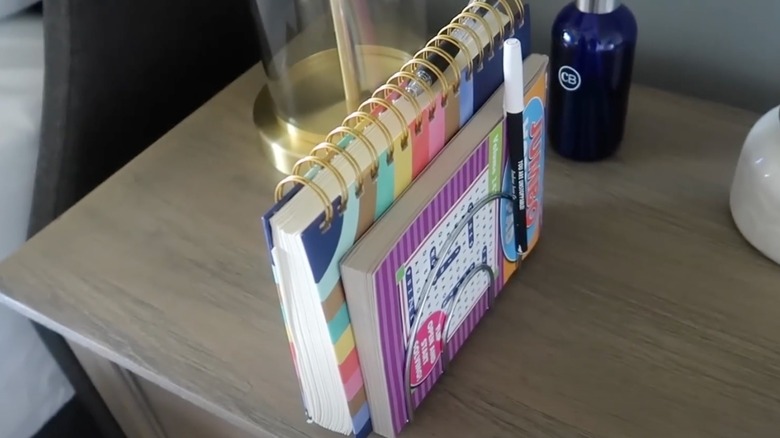 Napkin holder holding activity books