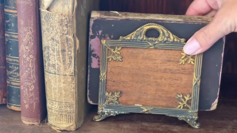 Thrifted napkin holder as shelf bookend