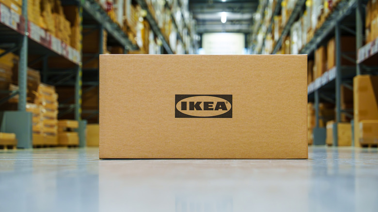 Box with IKEA on it in the middle of the store aisle