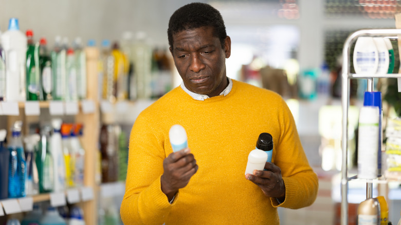 person in store examining products