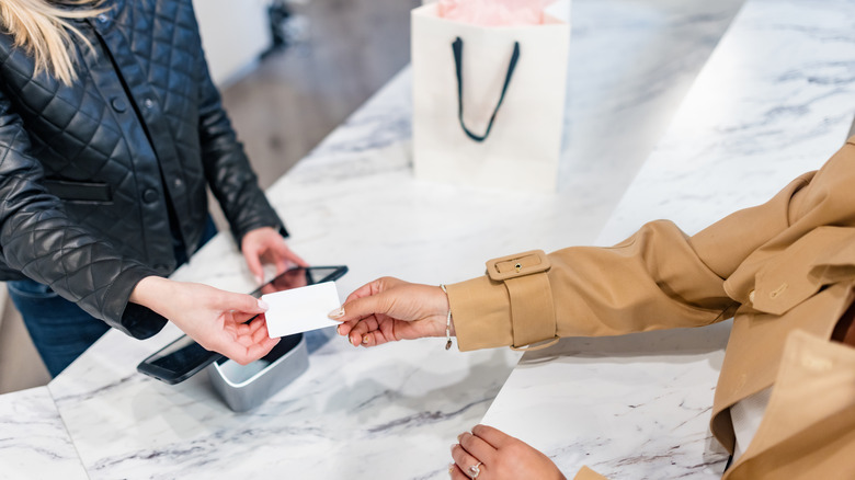 customer paying for purchases with a gift card