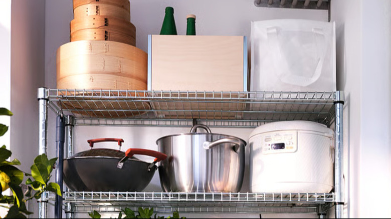 Top of IKEA shelf unit with cooking pots and pans