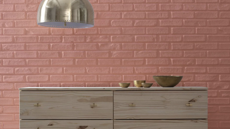 Room with dresser and lamp, Red River Clay wall paint.
