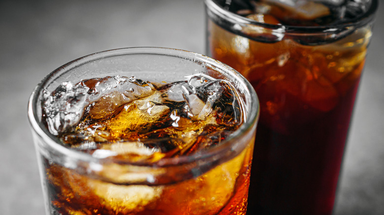 Two glass cups of brown soda