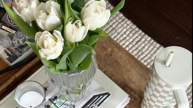 white peony tulips in a small vase on a tray
