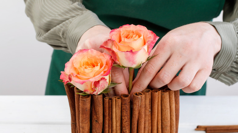 cinnamon stick centerpiece with roses