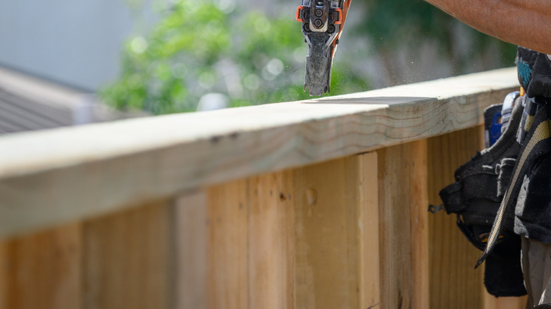 Person building a fence