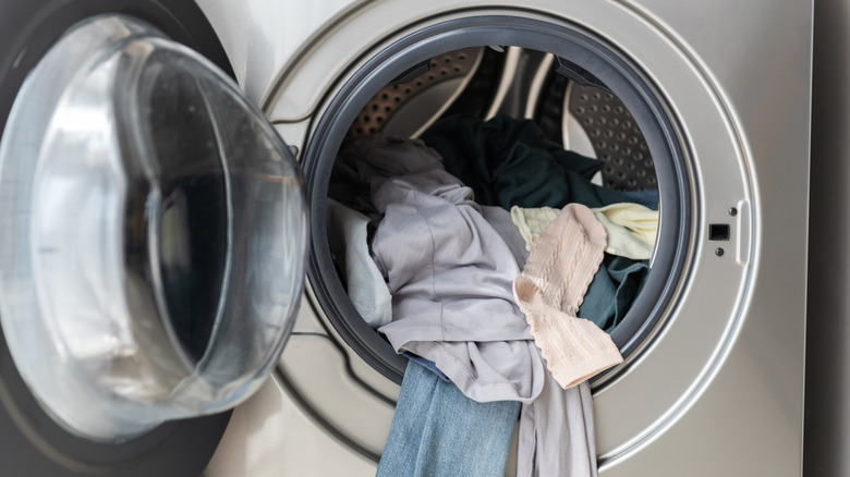 front load dryer with clothes spilling out