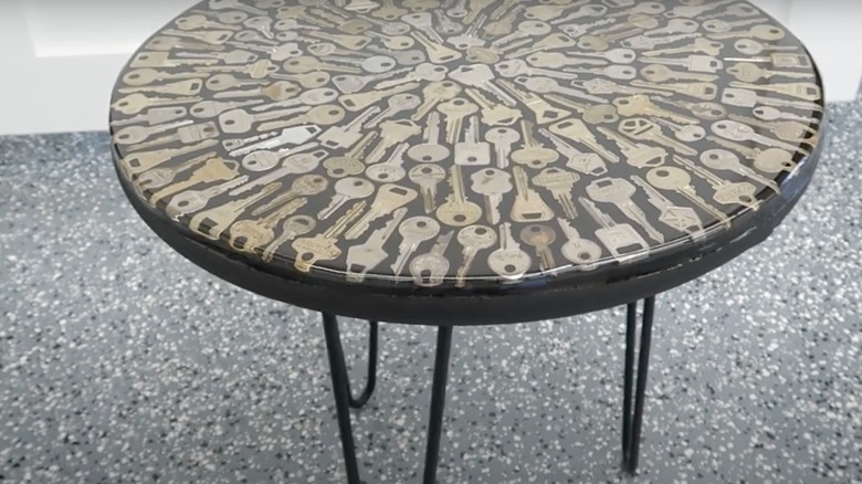 Keys inside black side table covered in epoxy