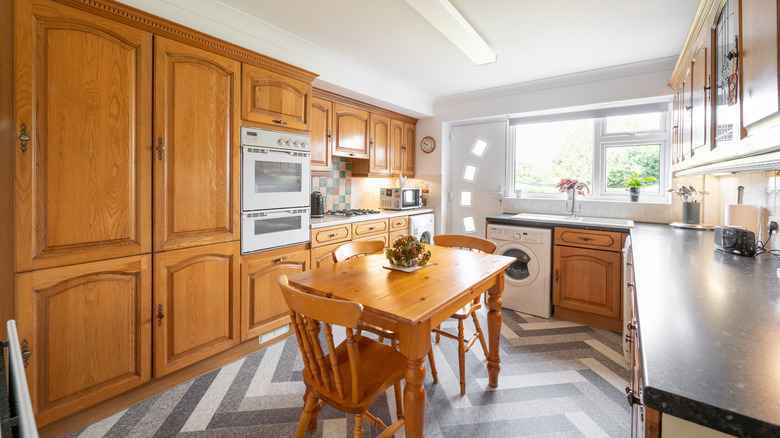 Kitchen with orangey oak cabinets