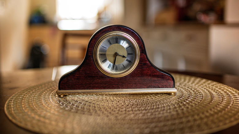 Vintage wood and brass mantel clock.