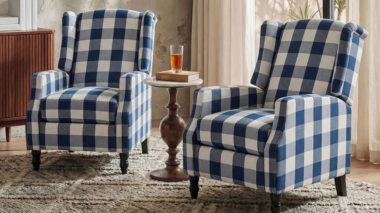 A pair of navy and white gingham armchairs in a living room