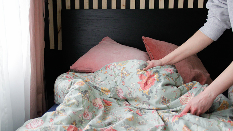 Floral bedding with solid throw pillows
