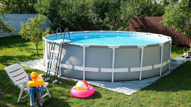 Backyard above ground pool with floaties