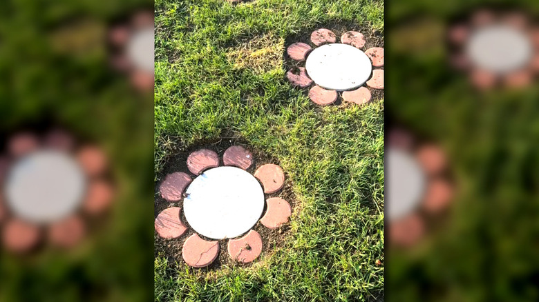 A flower paver walkway installed on grass.