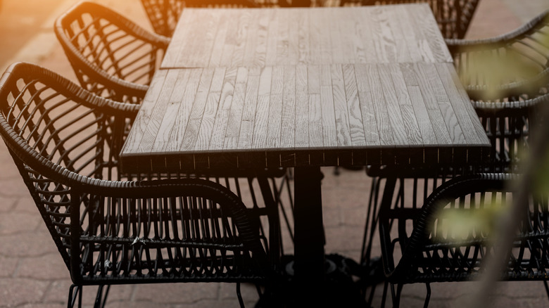 Woven chairs and wood table