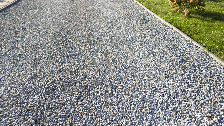 gravel pathway running alongside some grass at the side of the road