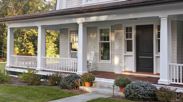 A front porch with white columns