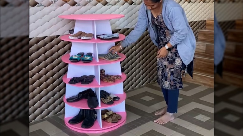 Pink and white shoe rack made from cardboard