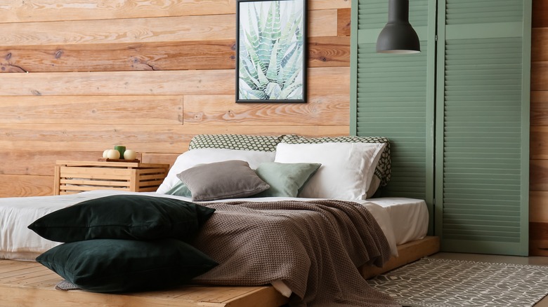 bedroom with wood wall