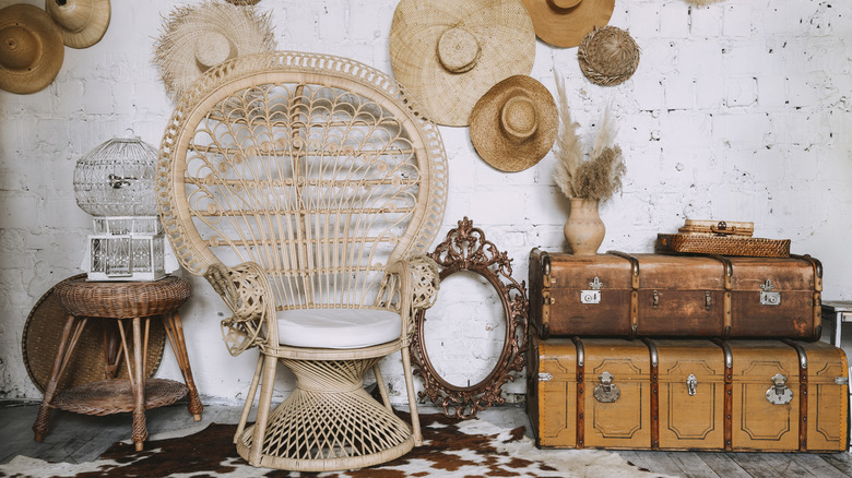 rattan chair with hats on wall
