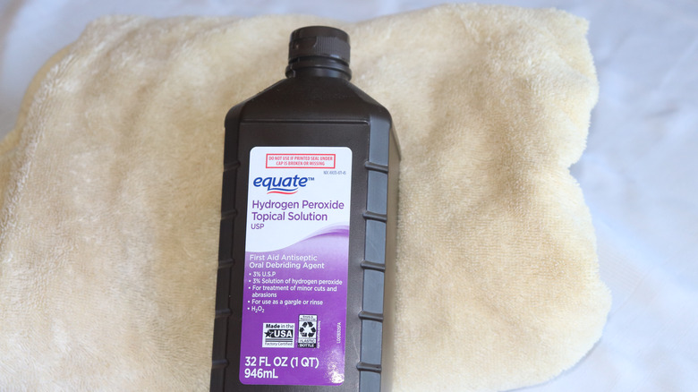 hydrogen peroxde bottle on towel