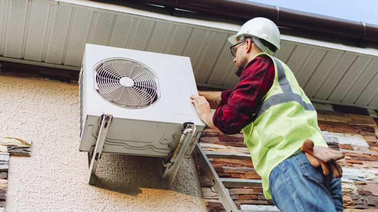 Man installing a heat pump