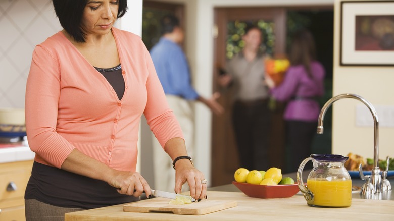 Woman cutting lemons 