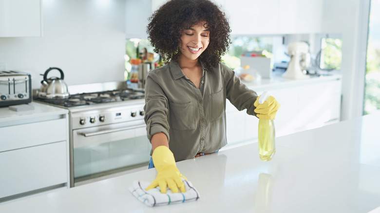 Person wiping laminate countertops