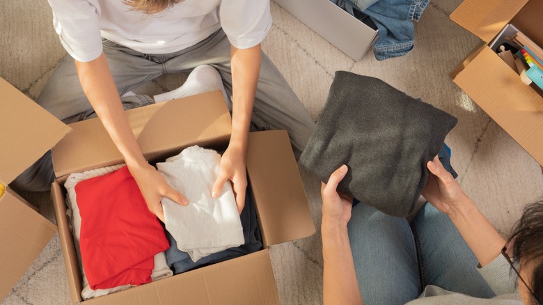 People sorting through items