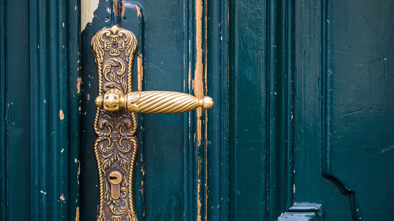 a tarnished brass door handle