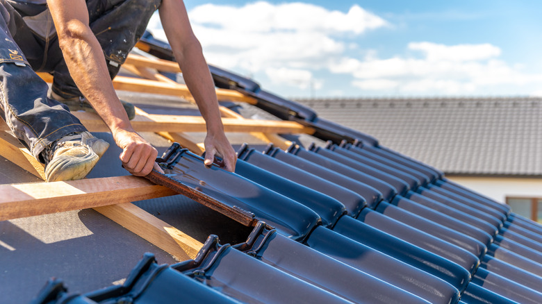 Man fixes roof