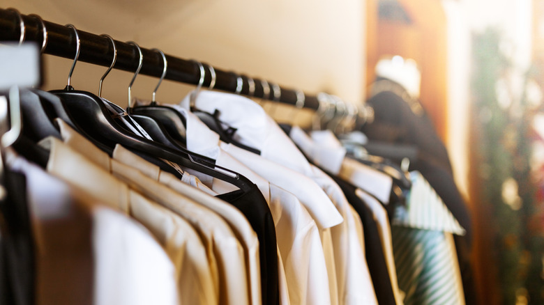 shirts hanging from black bar