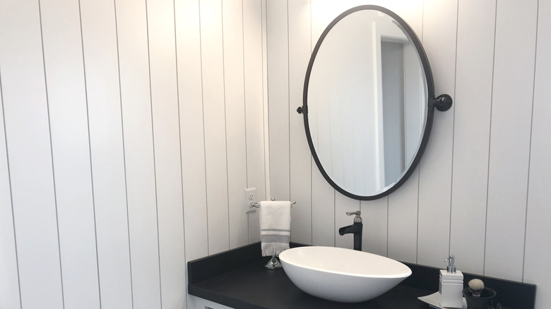 White wood panel walls in bathroom