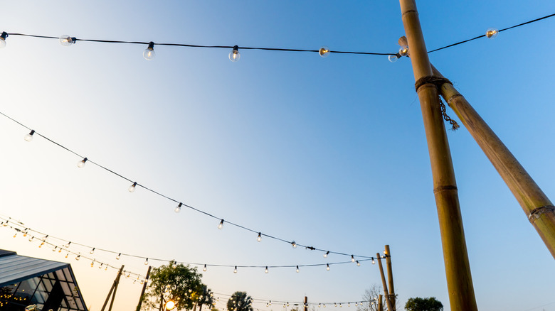 String lights attached to sturdy posts outside