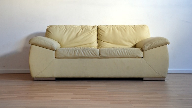 Beige couch on wood floor