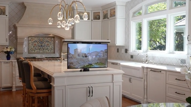 Small TV lifted out of kitchen island countertop