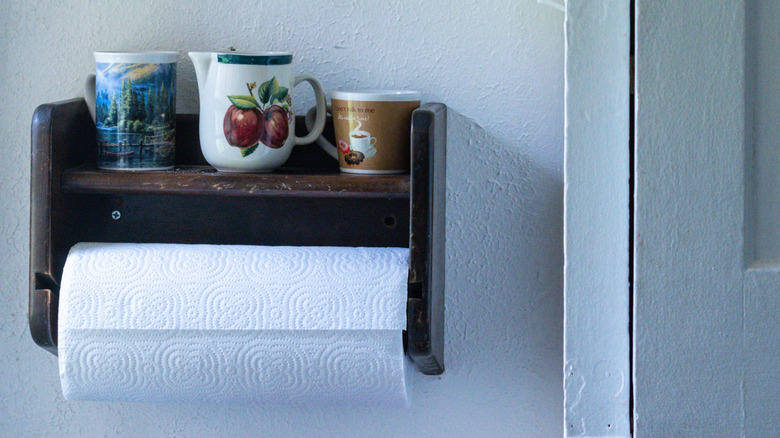 Close up of a vintage, wooden paper towel holder
