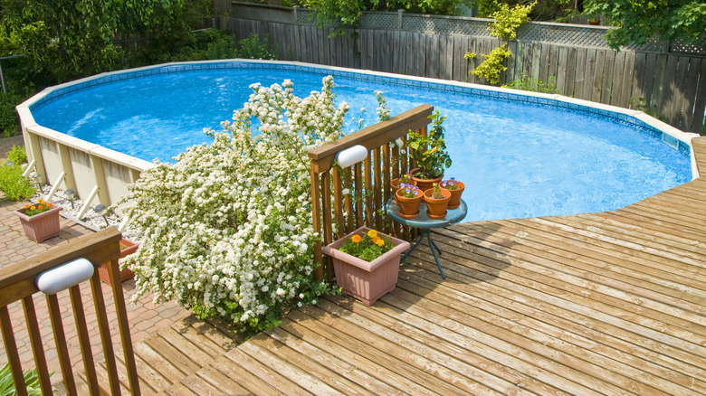 Above-ground pool with wood deck