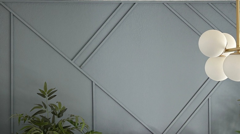 An accent wall with a 3D geometric design.