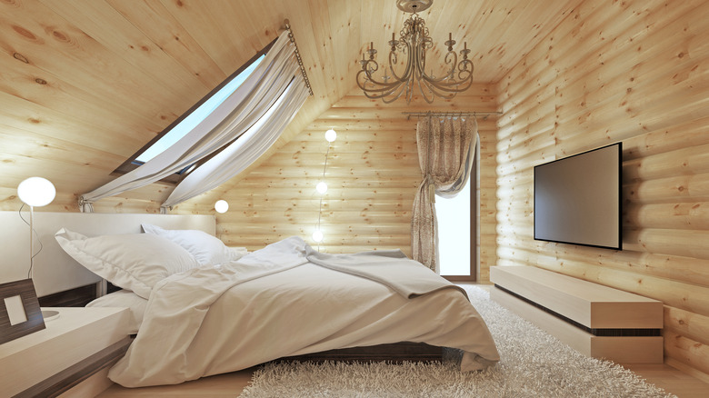 cottage wooden bedroom with chandelier