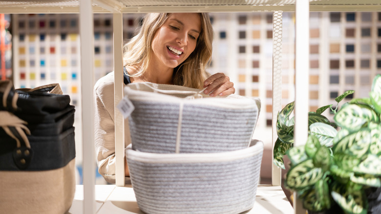 woman shopping for blue baskets