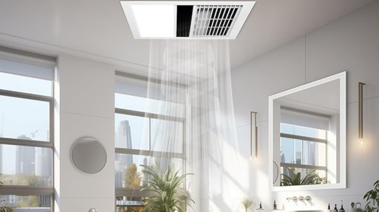 Modern bathroom with fan heater above toilet.